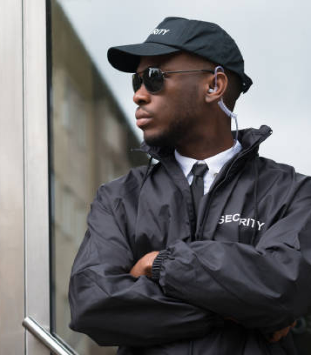 security-guard-standing-arms-cro